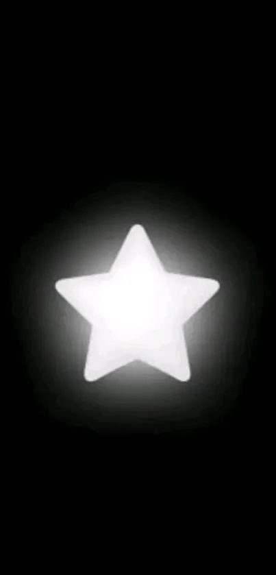 Minimalist wallpaper with glowing star on black background.