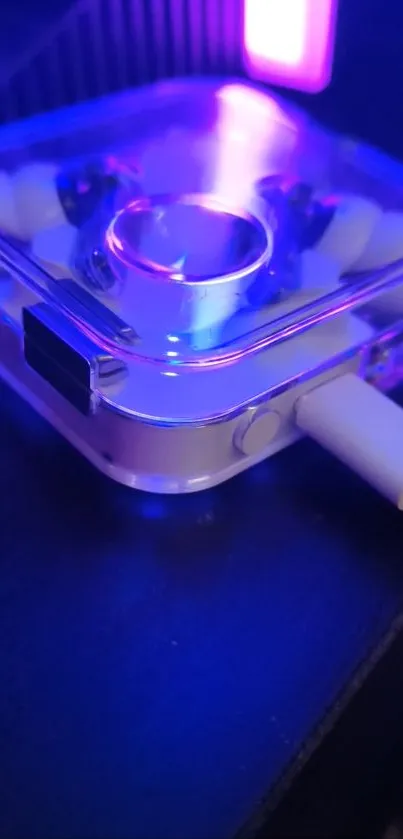 Neon blue and purple tech gadget glowing on a black surface.