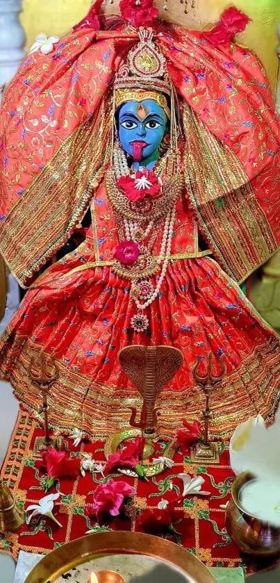 Vibrant image of Hindu goddess Kali in red attire adorned with ornaments.