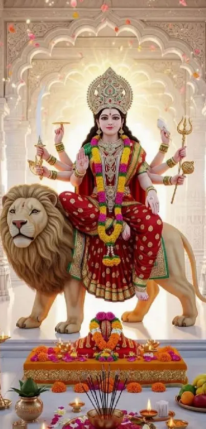 Goddess sitting on a lion in a temple with vibrant decor and flowers.