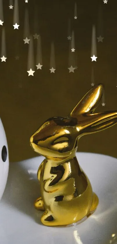 Elegant gold bunny next to a polka dot egg on decorative plate.