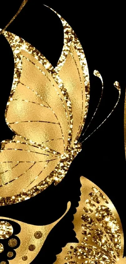 Gold butterfly wallpaper with dark background and glitter details.