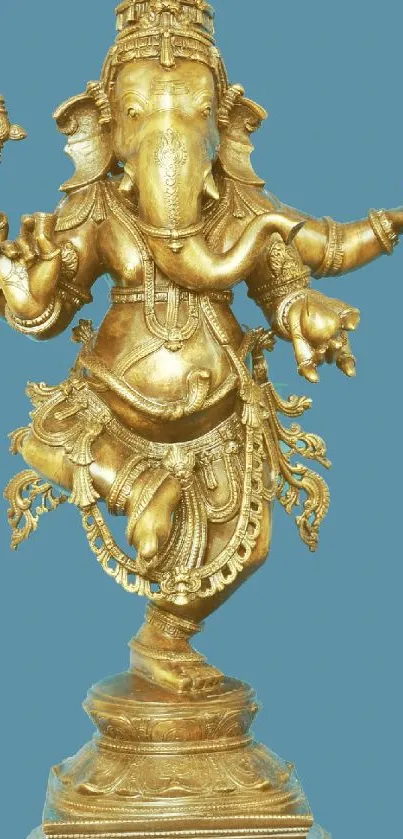 Golden Ganesha statue with a blue background for mobile wallpaper.