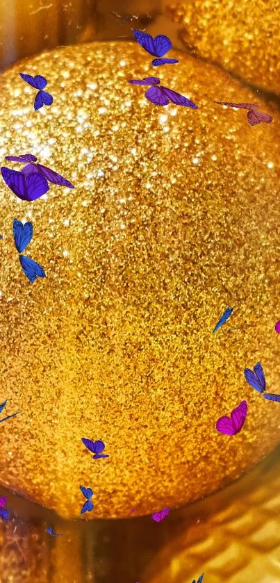 Gold glitter ball with colorful butterflies.