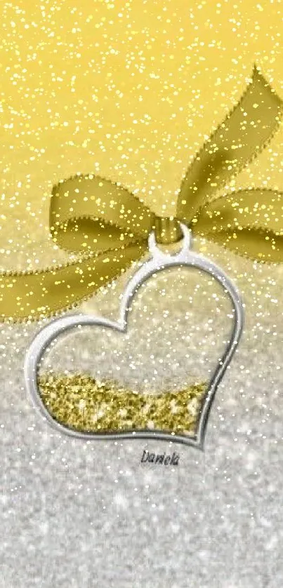 Gold gradient wallpaper with a shiny heart pendant and ribbons.