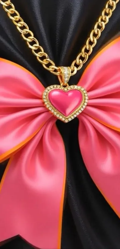 Gold chain with pink bow and heart pendant.