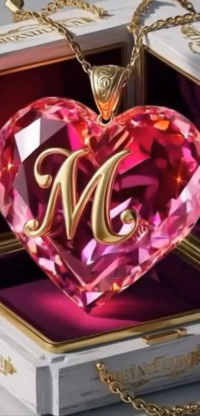 Heart-shaped pink pendant with golden 'M'.