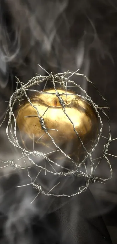 Golden apple wrapped in barbed wire on a dark background.