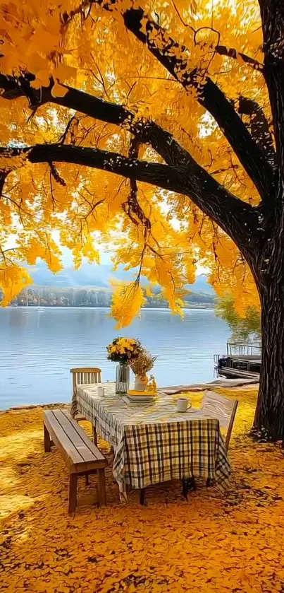 Autumn leaves canopy over lakeside picnic table.