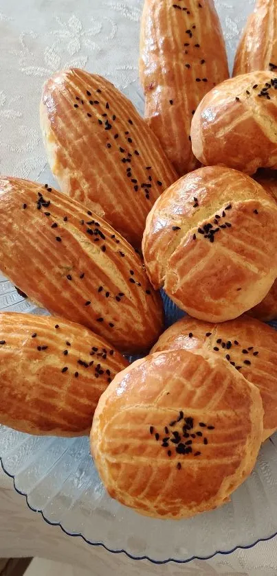 Golden baked pastries on a plate, perfect for food wallpapers.