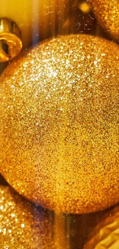 Mobile wallpaper with golden baubles and festive shimmer.
