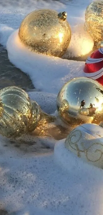 Glistening gold ornaments on a sandy beach with ocean waves.