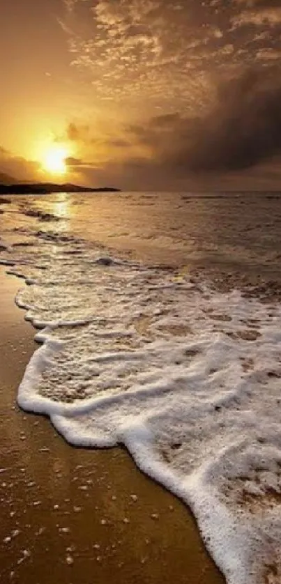 Mobile wallpaper of a golden beach sunset with waves.