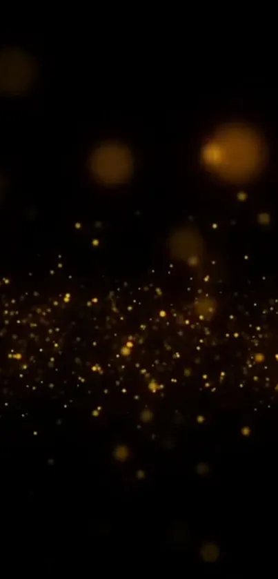 Golden bokeh glow on a dark background wallpaper.