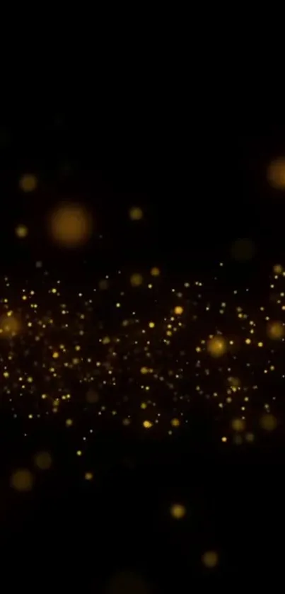 Golden bokeh particles on a black background mobile wallpaper.