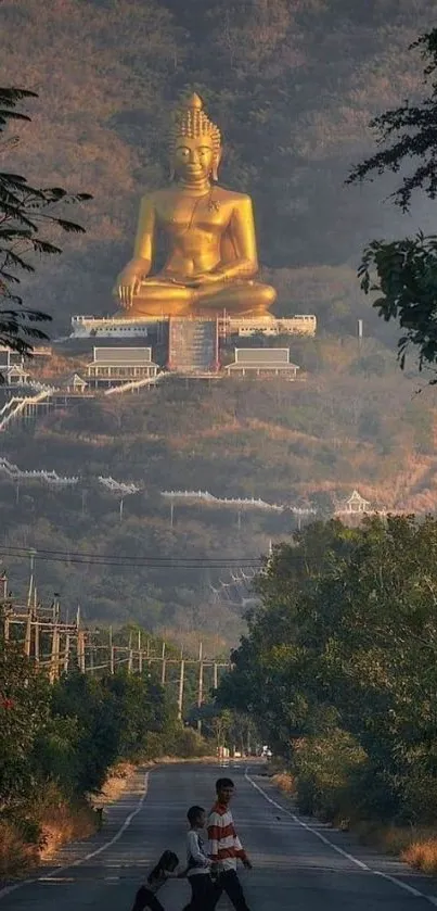 Golden Buddha statue on a lush hill with scenic view.