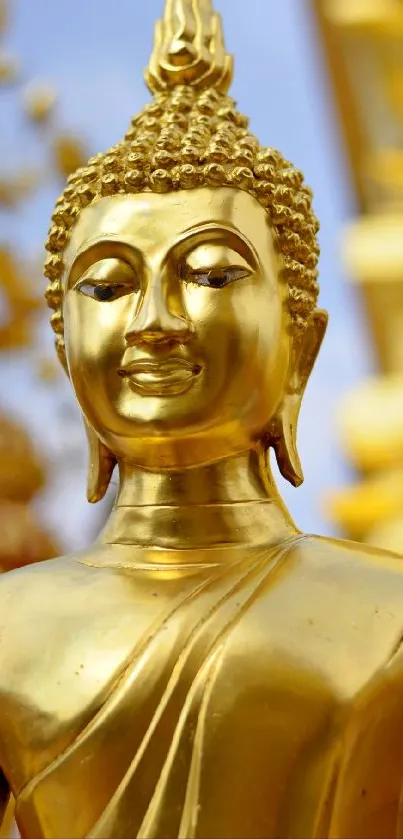 Golden Buddha statue with serene expression and vibrant details.