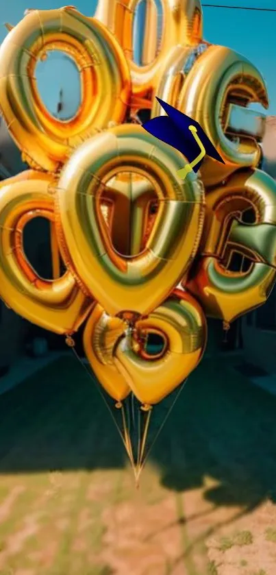 Gold letter balloons with graduation cap outside.