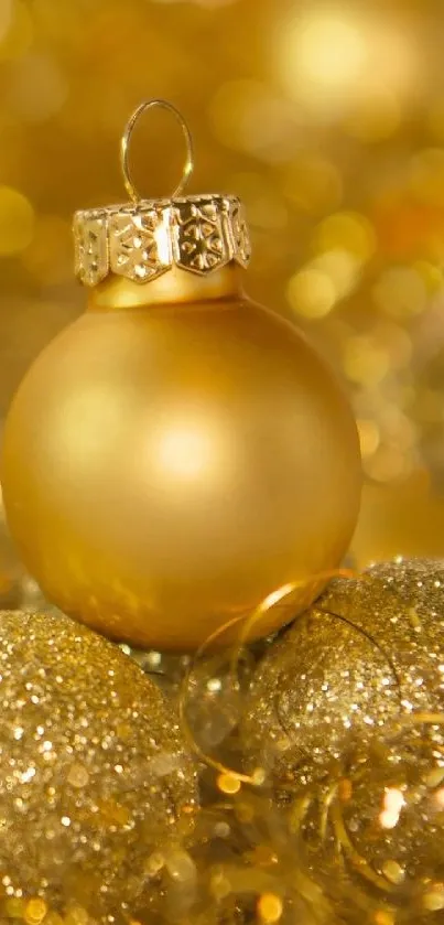 Golden Christmas ornament with sparkling festive background.