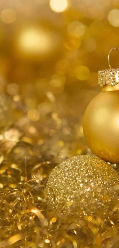 Golden Christmas ornaments and sparkles create a festive wallpaper.