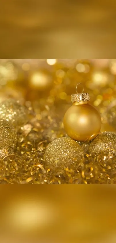 Golden Christmas ornaments on a sparkling background, perfect for mobile wallpaper.