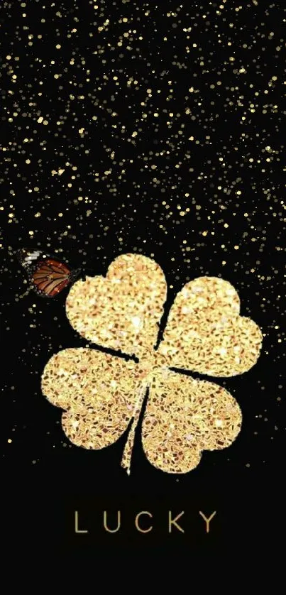 Black wallpaper with golden clover and butterfly.