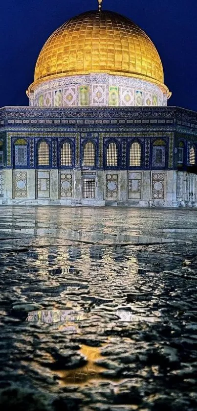 Golden dome reflecting in water at night.