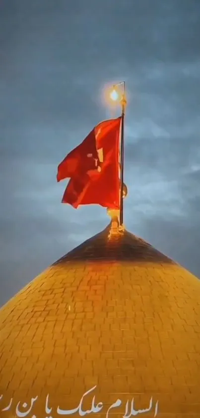 Golden dome with red flag against cloudy sky.