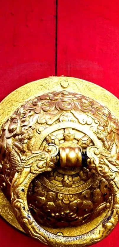 Intricate golden door knocker on a bold red background mobile wallpaper.