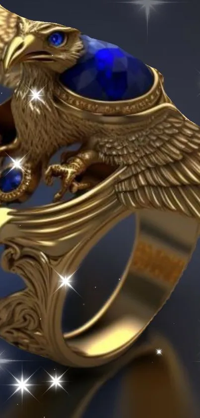 Golden eagle ring with blue gemstone on dark background.