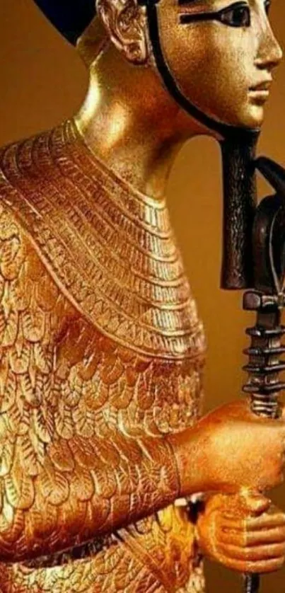 Golden Egyptian statue with intricate details.