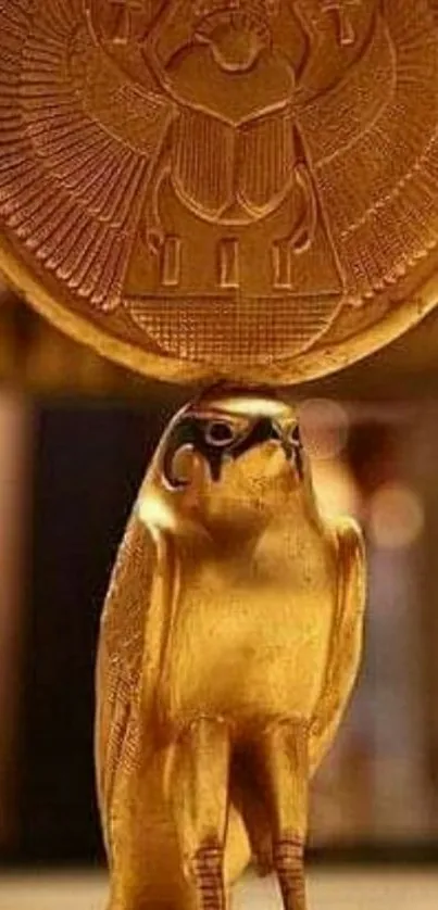 Golden Egyptian falcon with circular disk, rich historical art.