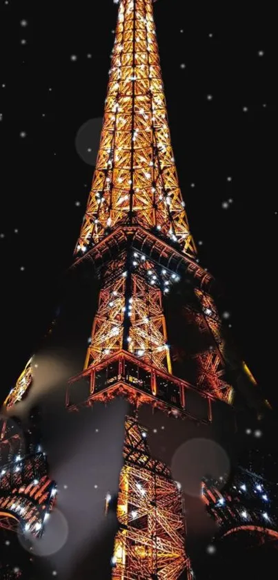 Eiffel Tower glowing at night with lights, perfect for mobile wallpaper.