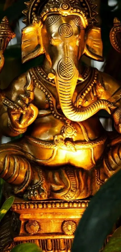 Golden Ganesha statue with warm light.