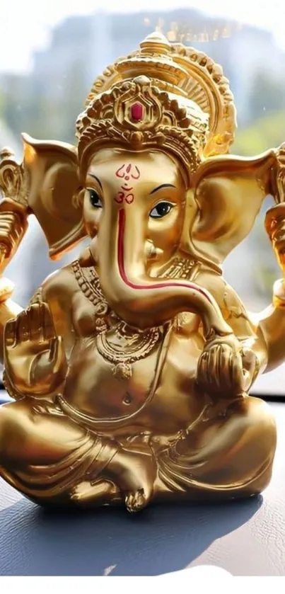 Golden Ganesha statue on car dashboard, vibrant and spiritual.