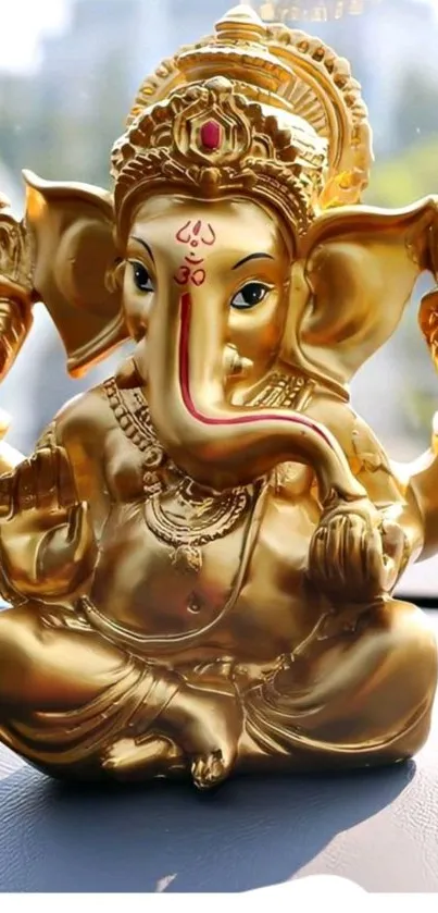 Golden Ganesha statue wallpaper for mobile screen.