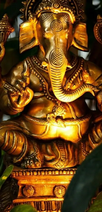 Golden Ganesha statue as mobile wallpaper.