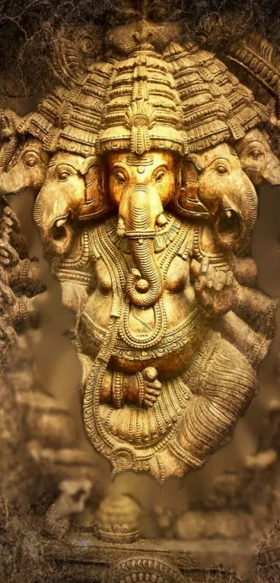 Golden Ganesha sculpture mobile wallpaper with intricate details.