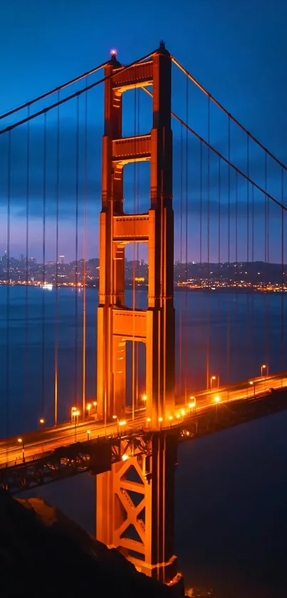 Golden Gate Bridge glowing at dusk with vibrant orange and blue colors.