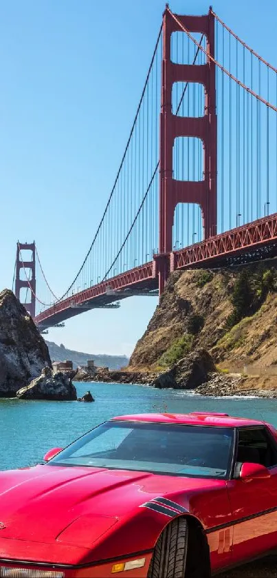 Red sports car by Golden Gate Bridge at San Francisco Bay.