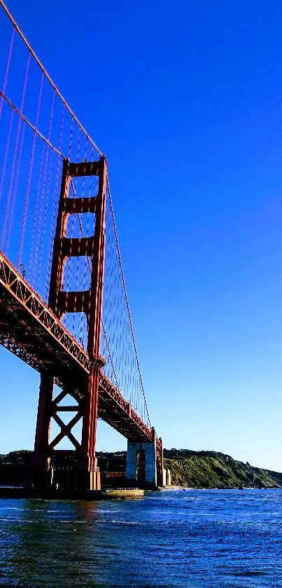 Golden Gate Bridge with blue sky and water, stunning mobile wallpaper.