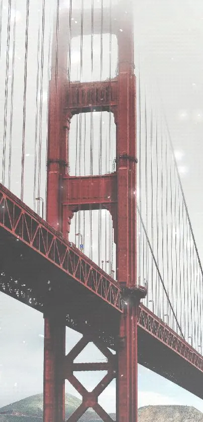 Mobile wallpaper of the foggy Golden Gate Bridge with red hues.