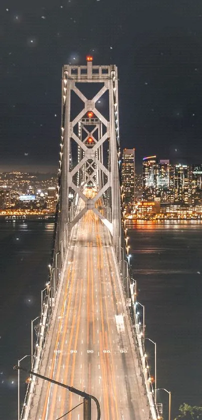 Golden Gate Bridge at night with city lights and skyline.