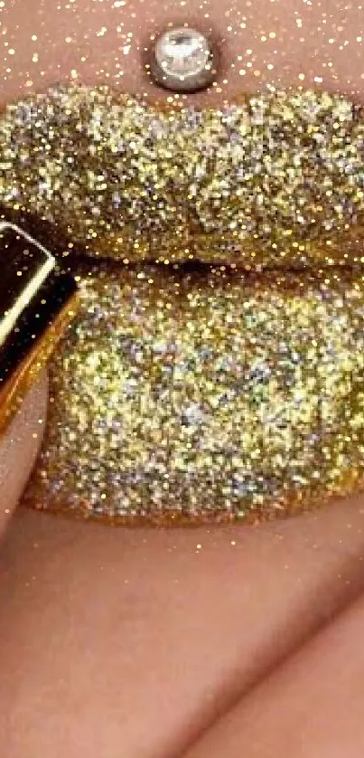 Mobile wallpaper featuring glittery gold lips and matching nails.