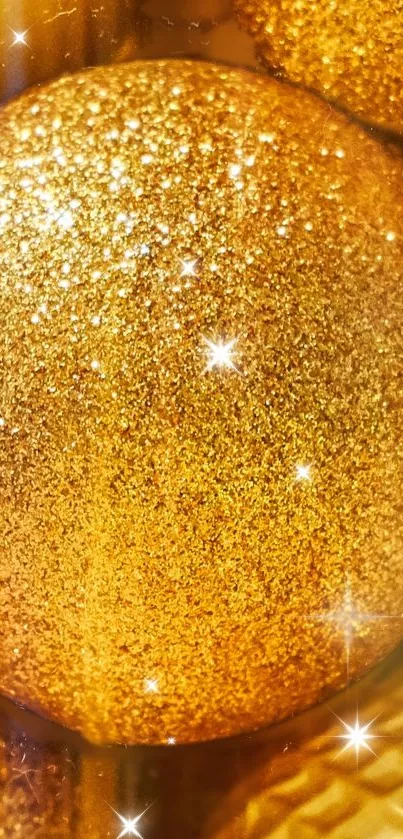 Shimmering golden ball with glitter sparkles.