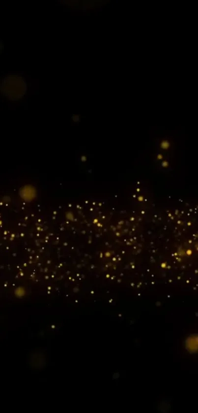 Golden glitter particles on a black background mobile wallpaper.