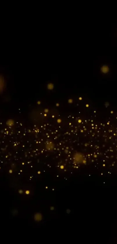 Golden glitter sparkles on black background mobile wallpaper.