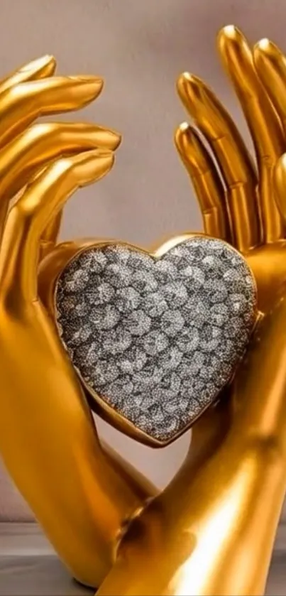 Golden hands holding a heart-shaped ornament.