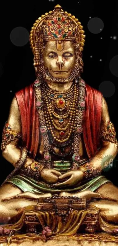 Golden Hanuman statue meditation art with detailed embellishments on a black background.