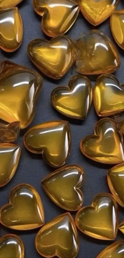 Golden heart-shaped gems on a dark background.